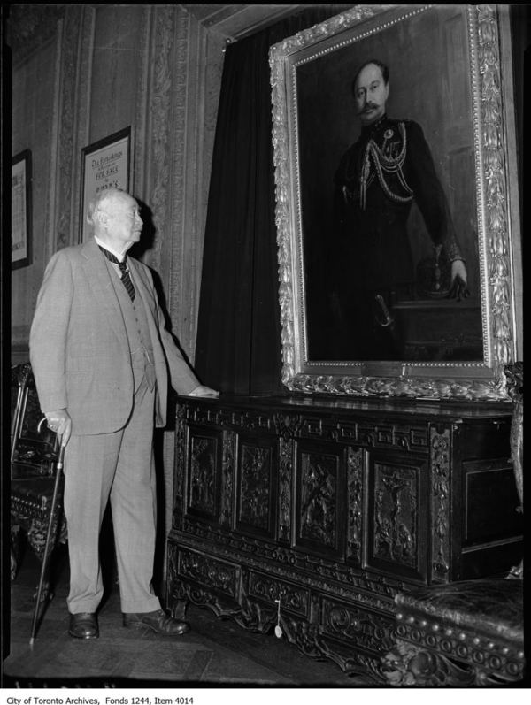 Original title:  Sir Henry Pellatt views his own portrait at Casa Loma. [ca. 1930]. City of Toronto Archives, Fonds 1244, Item 4014, William James family fonds.